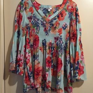 Floral blouse with cutout neckline.
